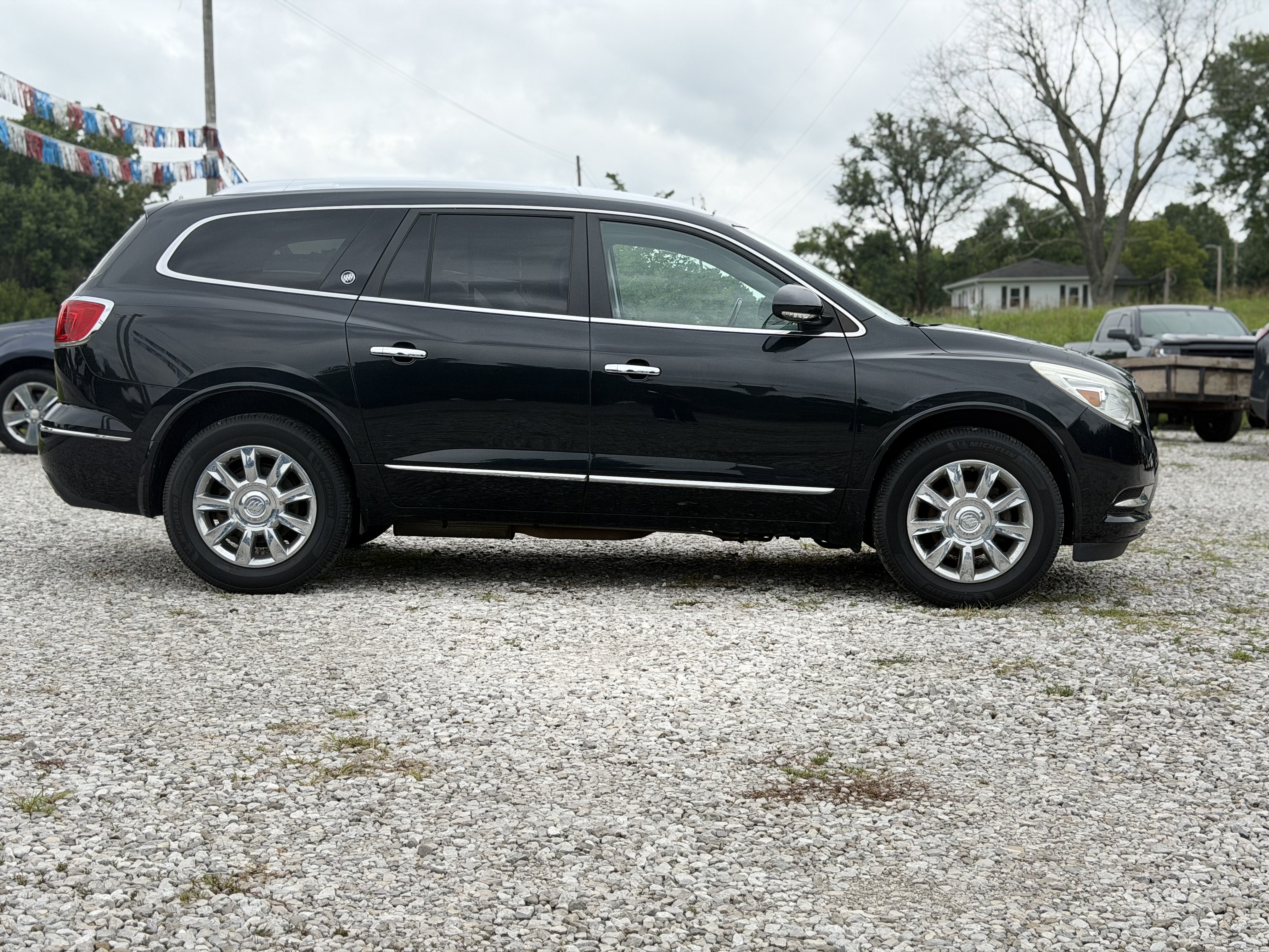 Black 2014 Buick Enclave side profile