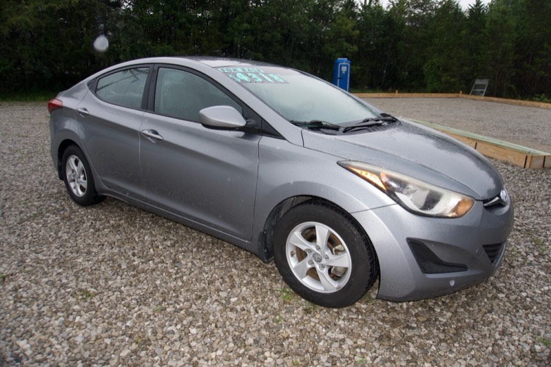 Silver Hyundai Elantra, front three-quarter with for-sale price sticker