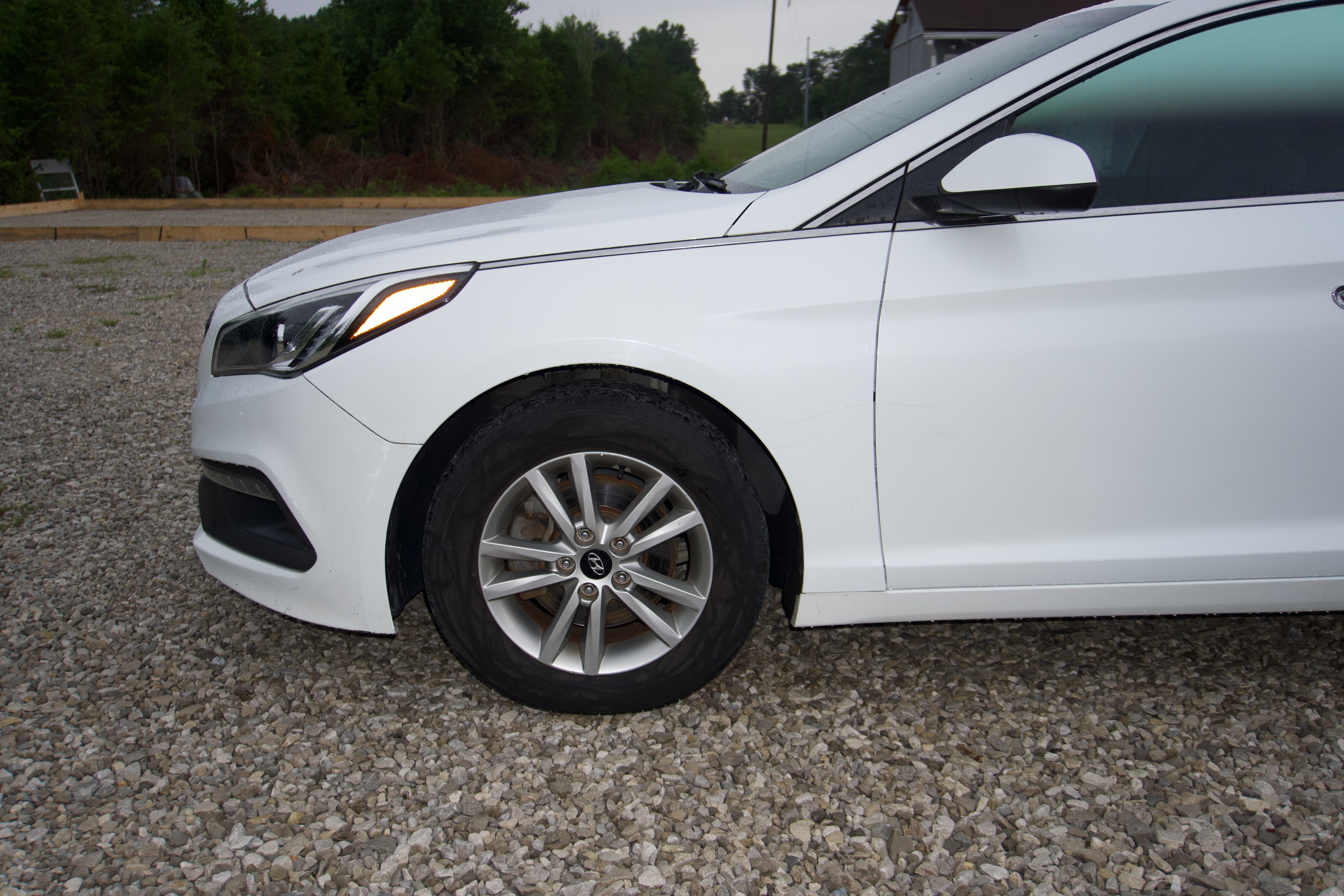 White 2016 Hyundai Sonata SE front wheel and headlight detail